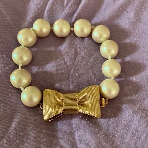 Beautiful Kate Spade beaded bracelet with gold tone bow clasp.